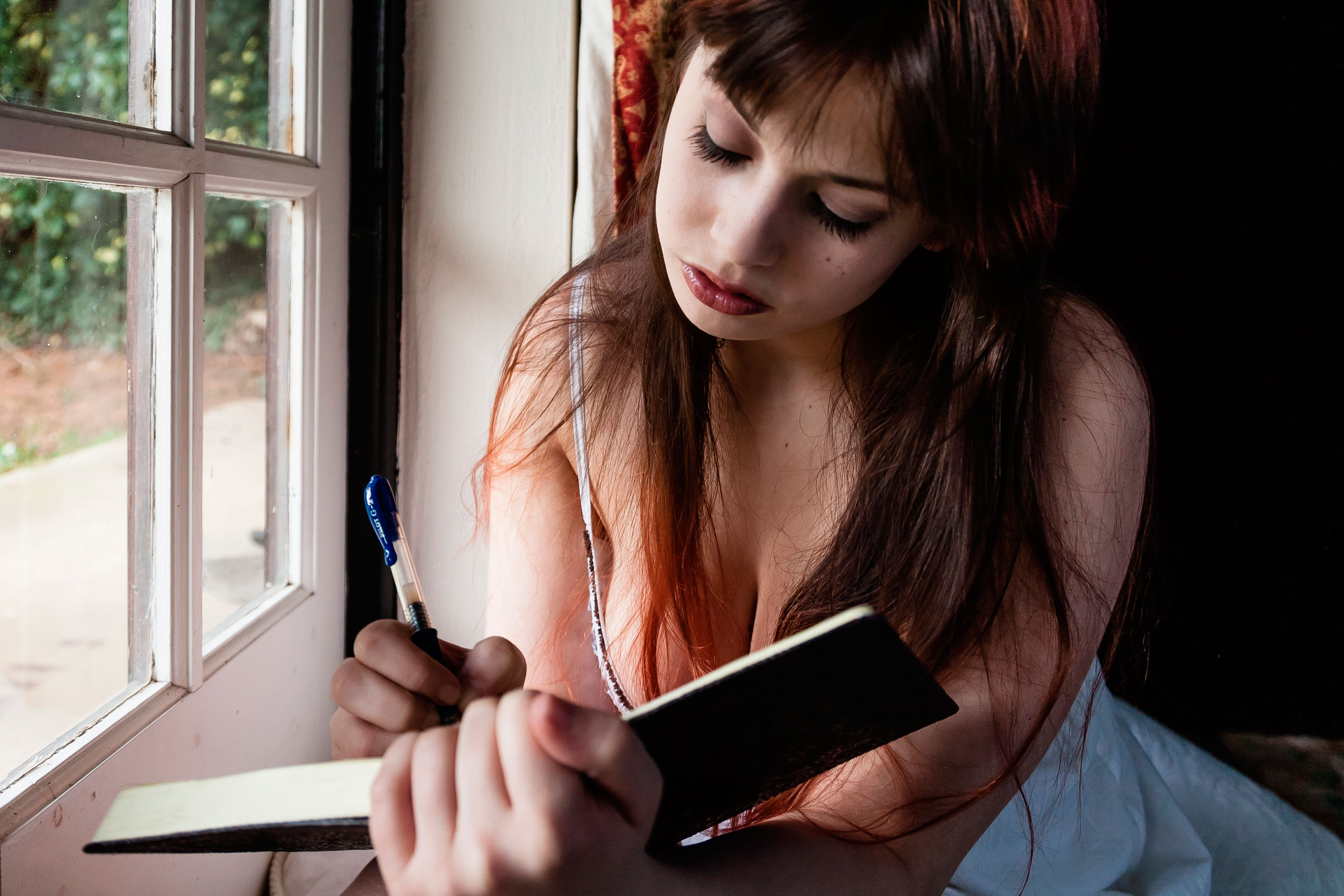 Woman writing in a notebook