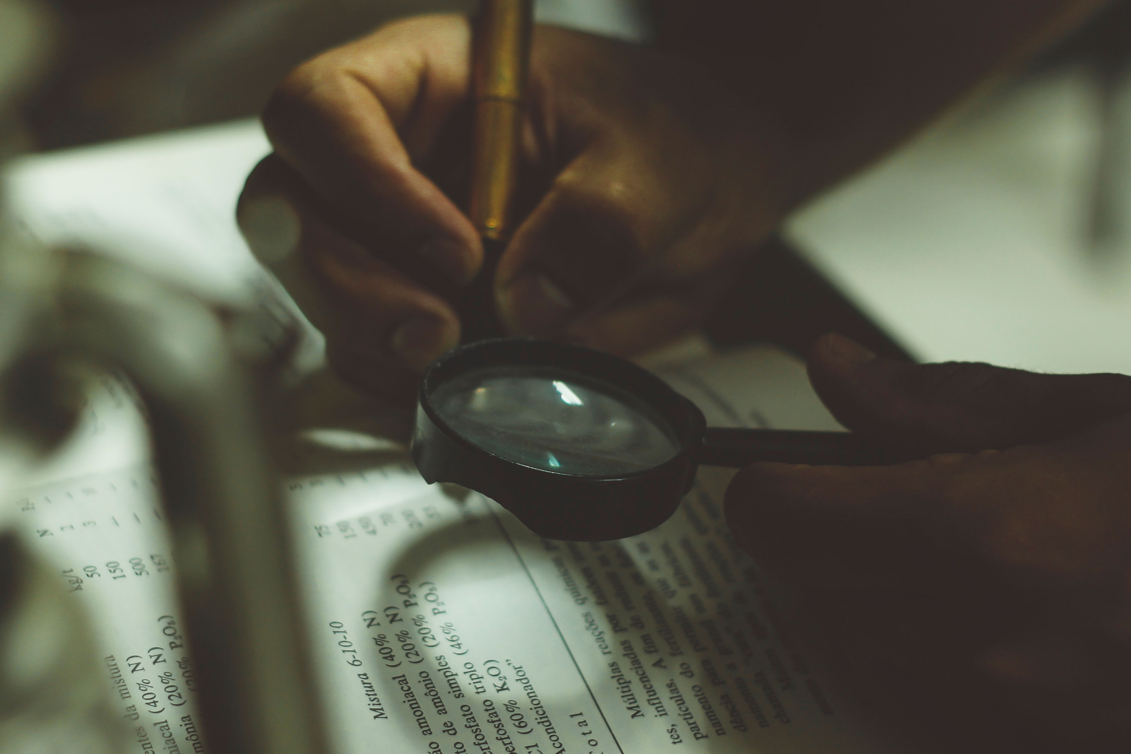 Hand and magnifying glass