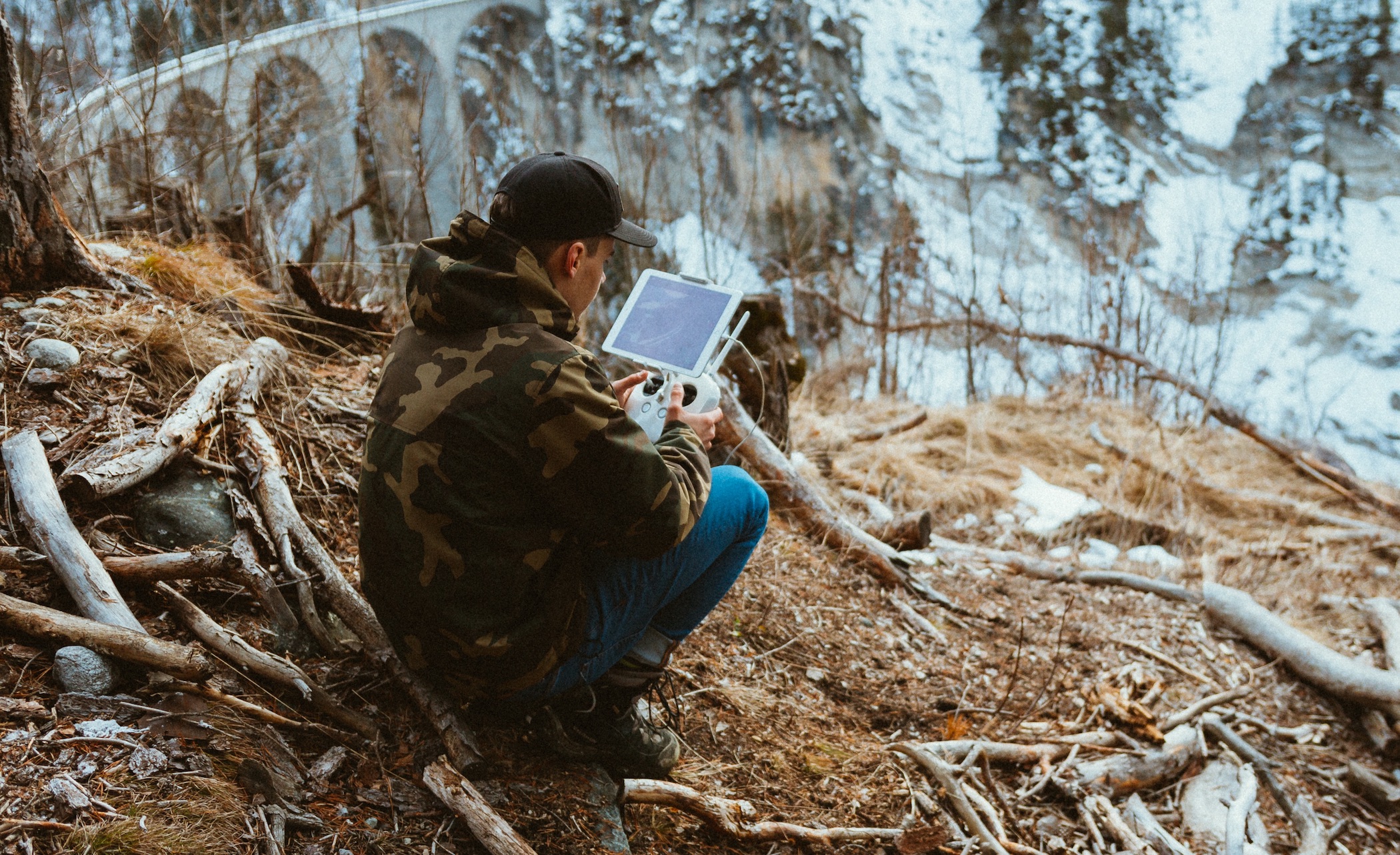 Man working in the woods on a tablet